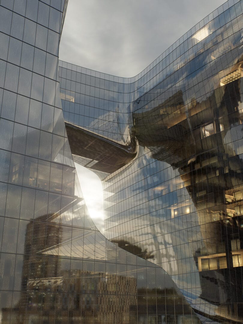 Visualização 3D de um prédio comercial conceitual revestido em vidro, capturado ao entardecer, com iluminação natural quente valorizando a arquitetura contemporânea.